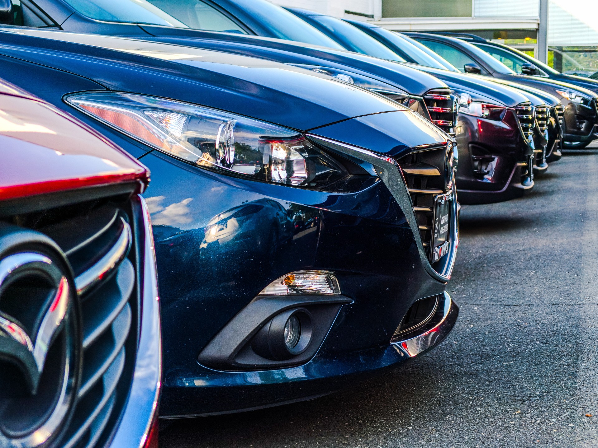 Cars for sale in a row at a car dealership